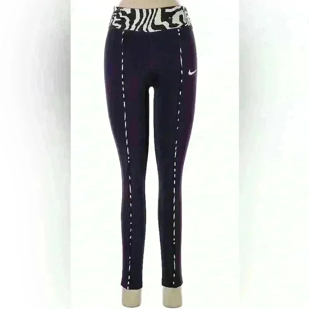 Nike Active pants size L in purple and green.